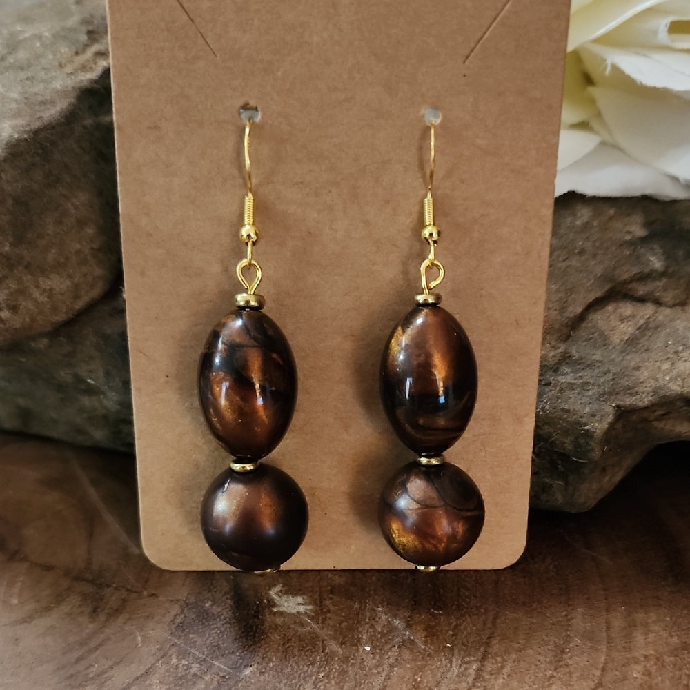 Gold Toned Dangle Earrings With Brown And Bronze Swirled Acrylic Beads
